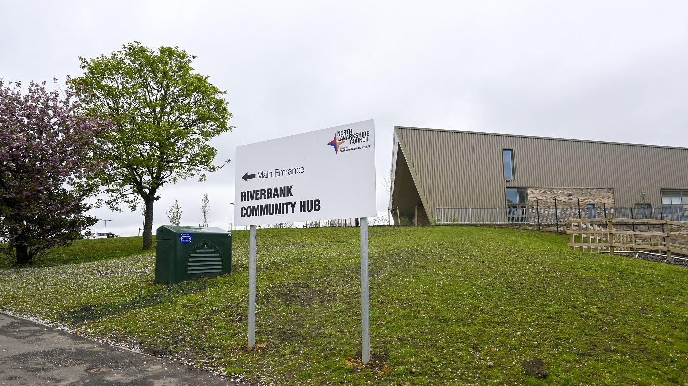 Riverbank Community Hub Post mounted panel directing visitors to the main entrance