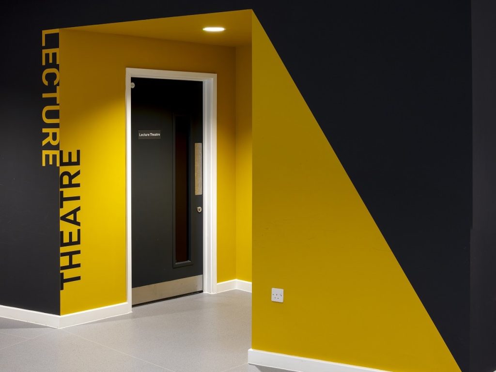Ponteland Schools cut vinyl wall text applied to an internal painted wall in contrasting colours.